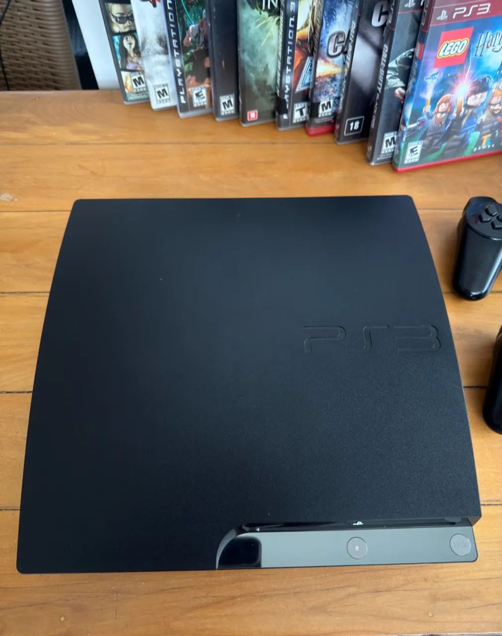 Ps3 slim com 2 controles e + de 20 jogos  - Foto 3