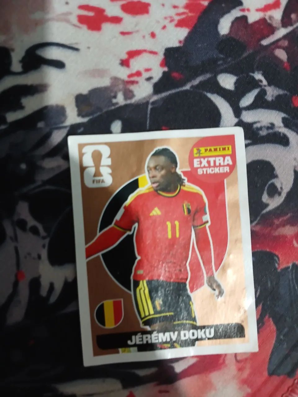 Figurinha de bronze do JÉRÉMY DOKU 