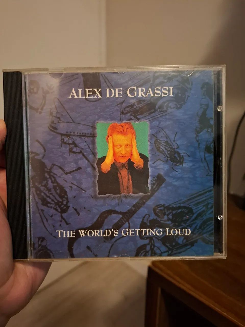 CD "The World's he World's Getting Loud" de Alex de Grassi