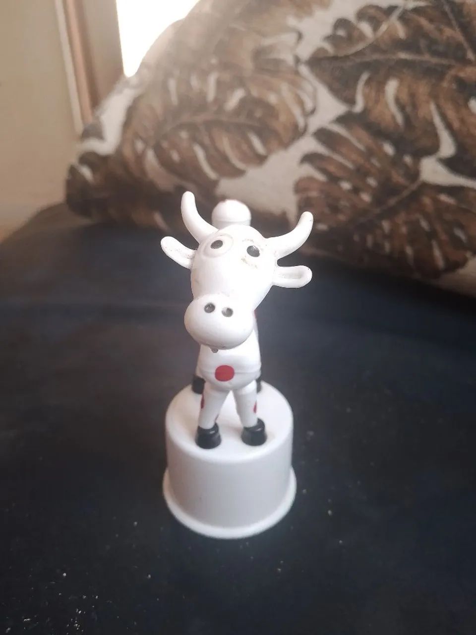 Vaquinha de brinquedo que se mexe