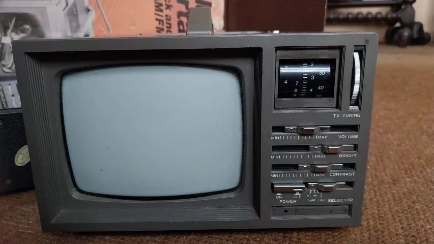 TV Deluxe Portable, 5" Black & White TV - AM/FM radio.