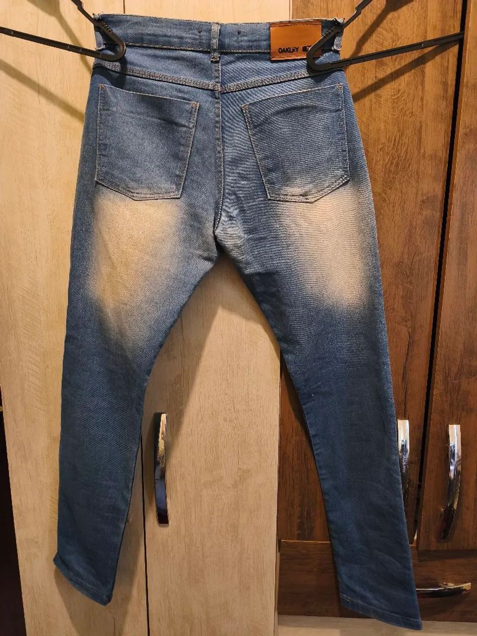 Calça jeans usada Oakley (38) - Foto 2