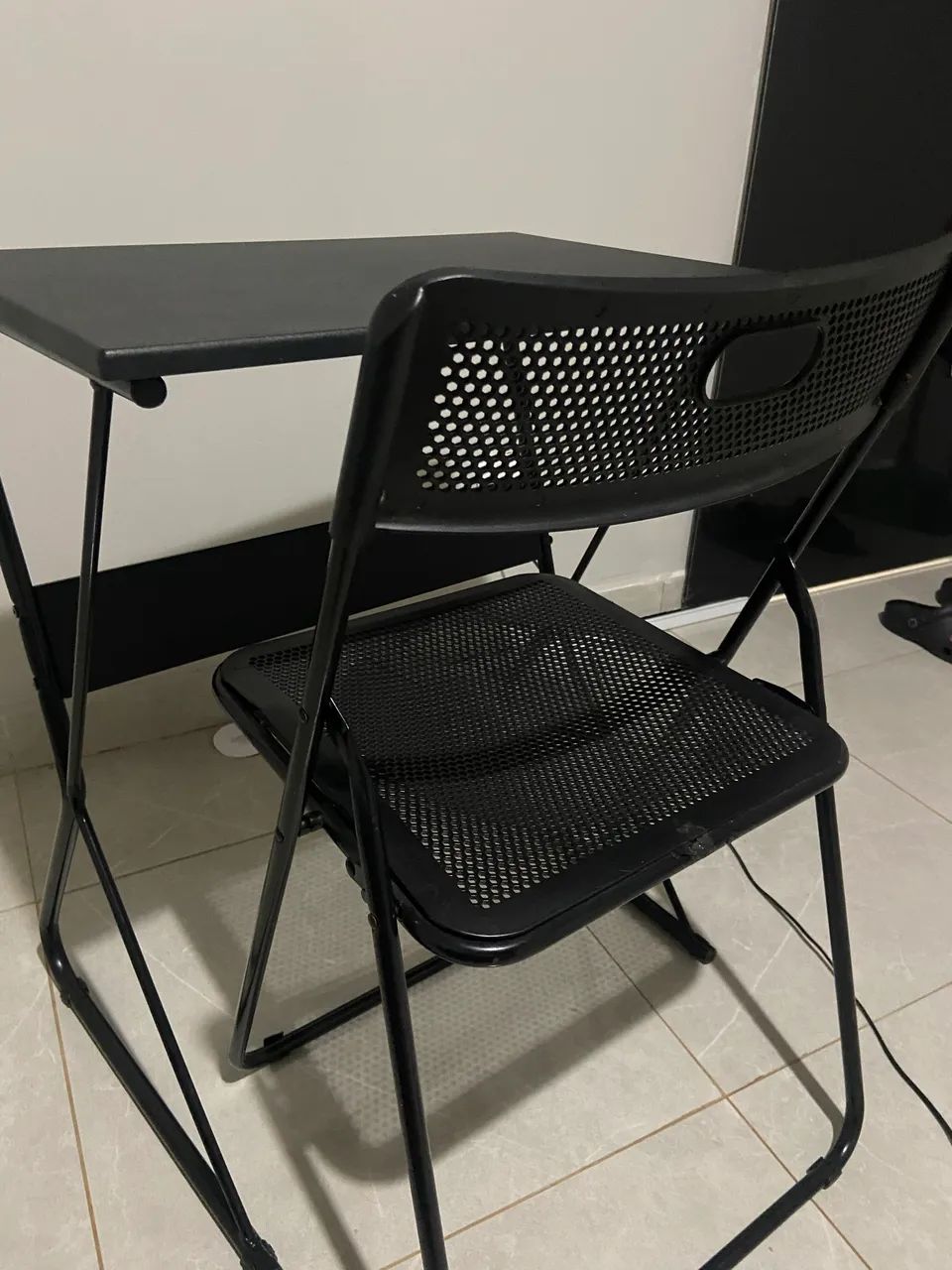 Black desk with folding chair