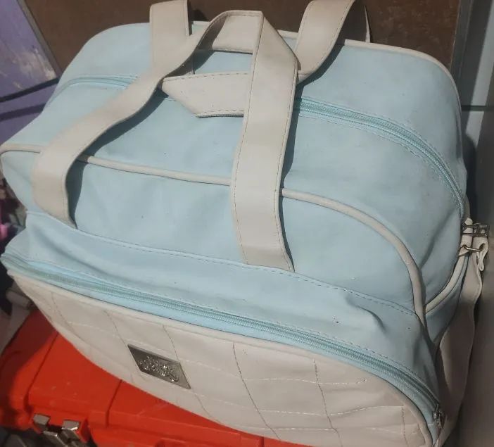Maternity bag with small newborn clothing lot
