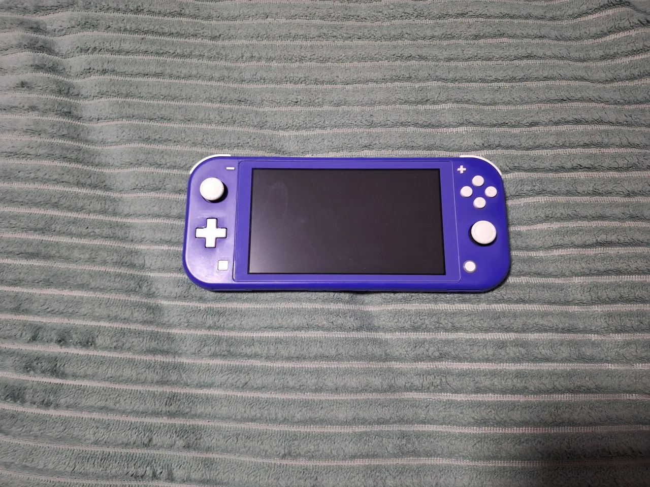 VENDO NINTENDO SWITCH LITE DESBLOQUEADO POR 1.400,00. WHATSAPP