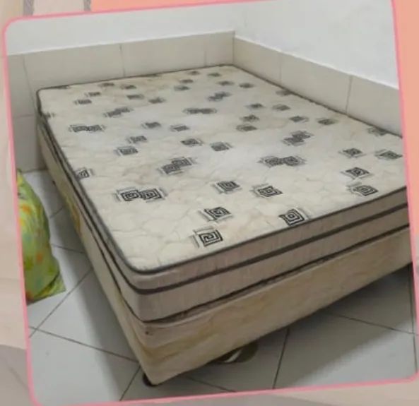 Double bed with well-maintained loose mattress