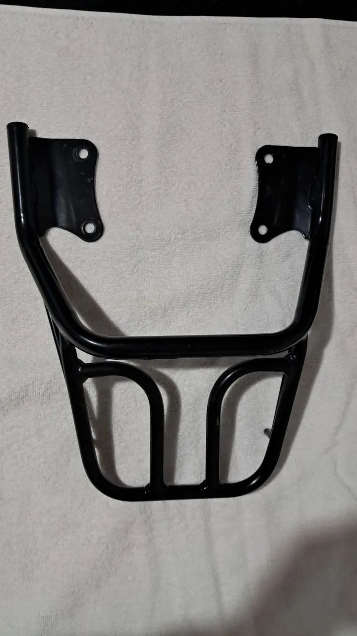 Vendo bagageiro moto Factor para baú. 
