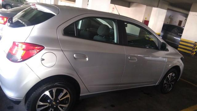 Chevrolet onix em perfeito estado, 4 pneus novos, único dono, nunca foi batido pago - Foto 3