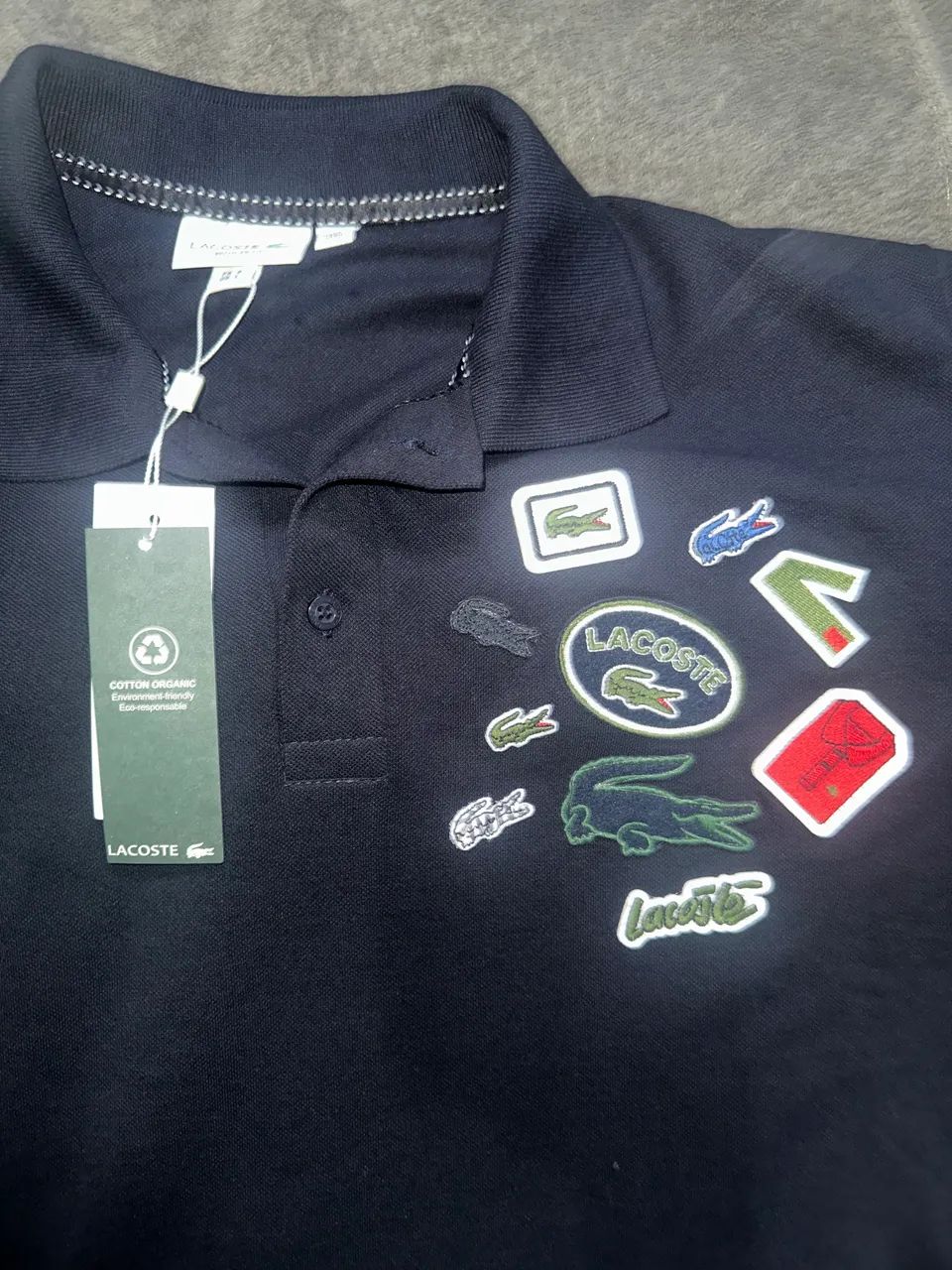 Polo Lacoste emblemas Site