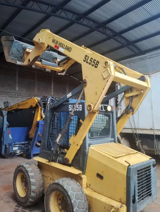 Bob cat New holland sl55b ano 2005  - Foto 5