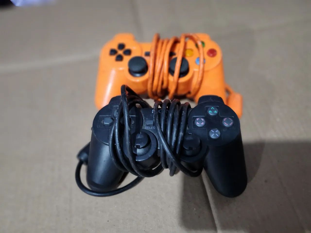 2controle pra Playstation 2,pra retirar peças 