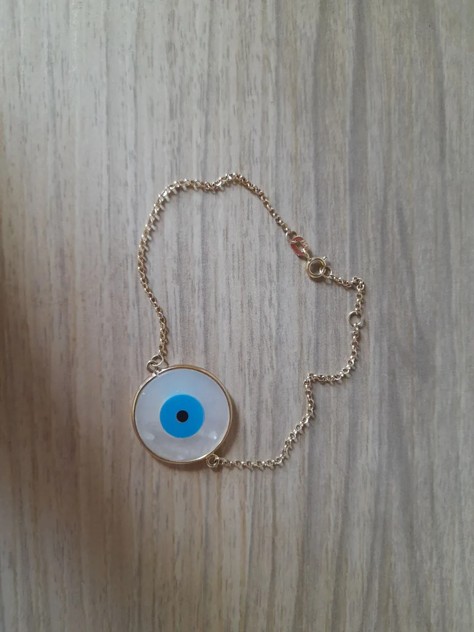 Pulseira olho grego ouro 18k