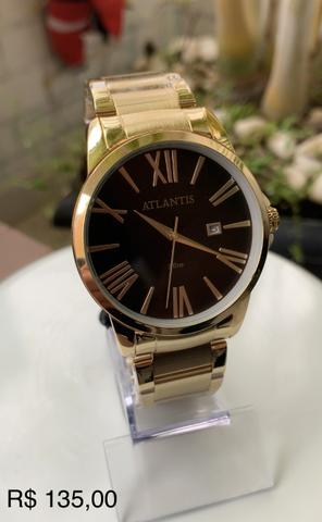 Relógio Atlantis dourado. Ótima qualidade. Aceitamos cartões !