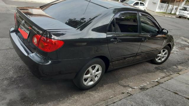 Corolla Preto 2004 1.8 mecanico XEI bancos de couro - Foto 2