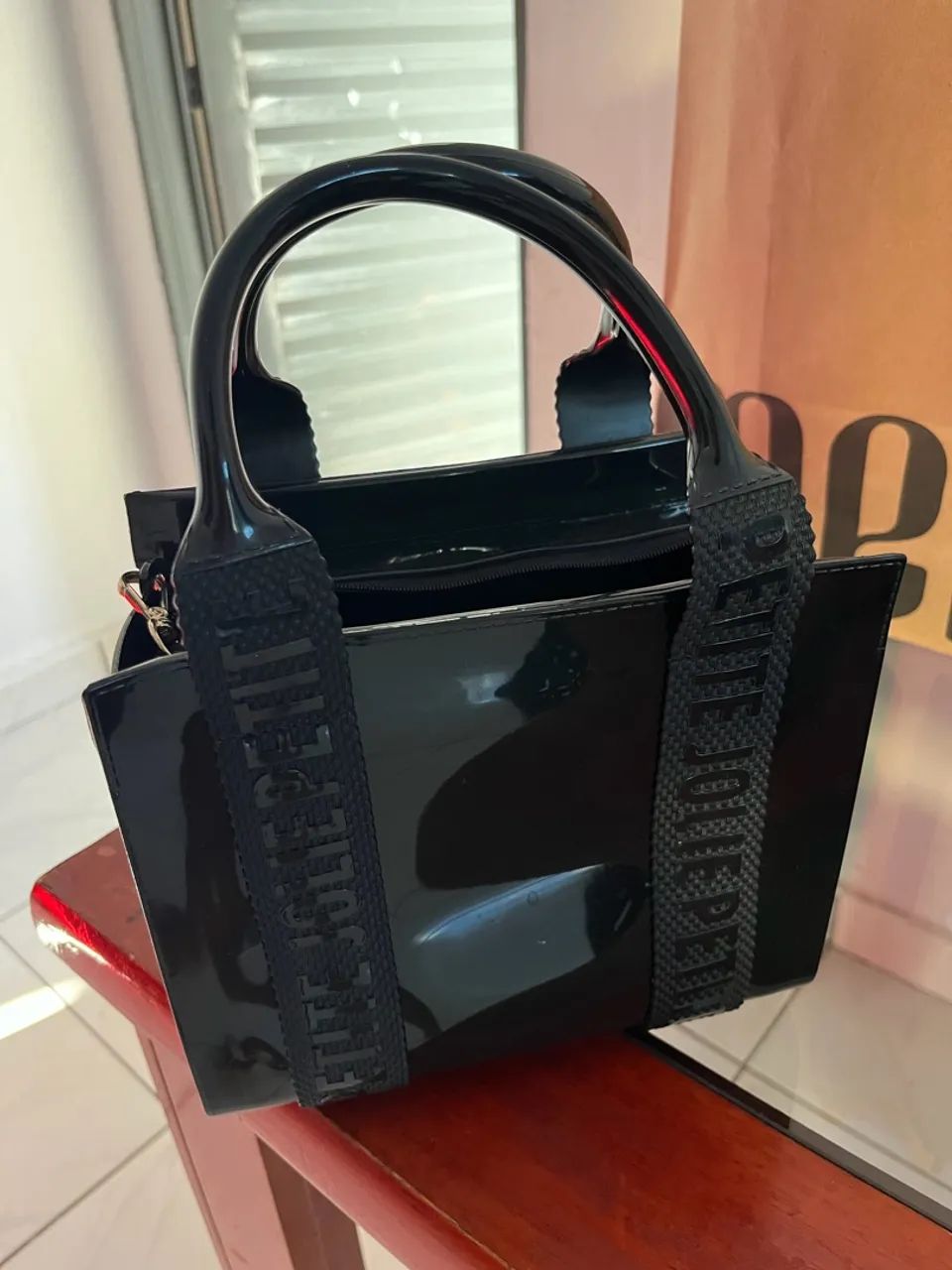 vendo essa bolsa petit jolie original nova 