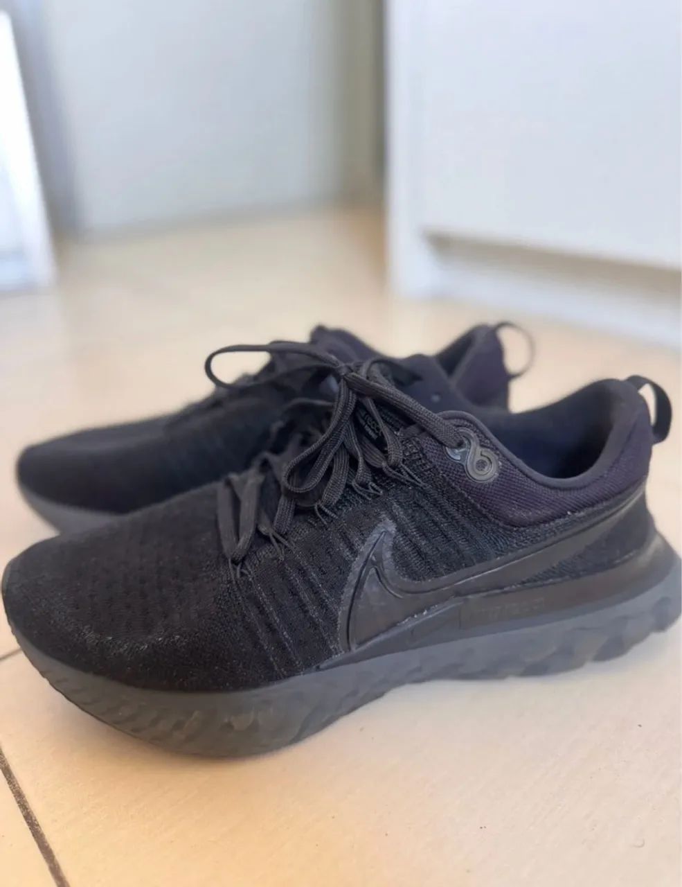 Tênis Nike React Infinity Run Flyknit - Preto - Calçados - Areias