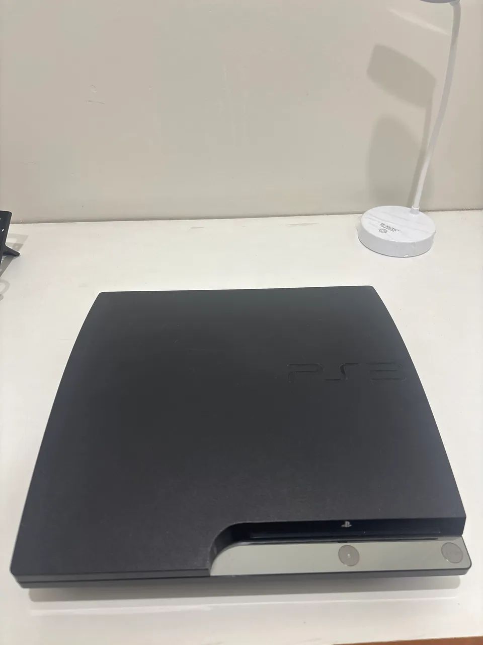 PlayStation slim com defeito 