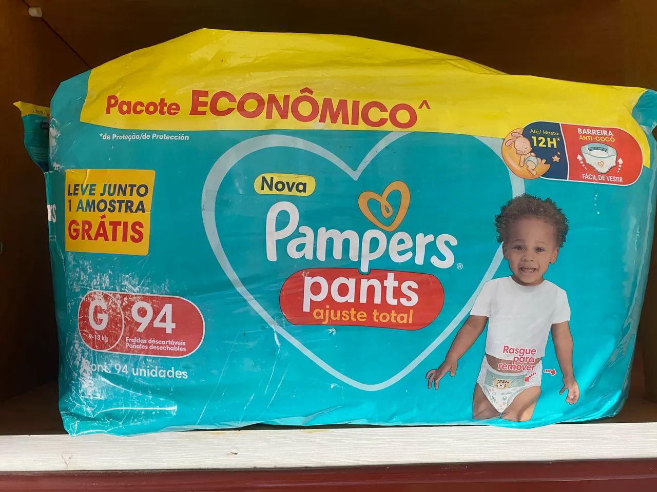 Fralda Pampers pants ajuste total 