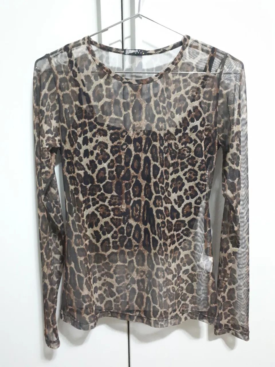 Blusa manga longa onça transparente com top preto 