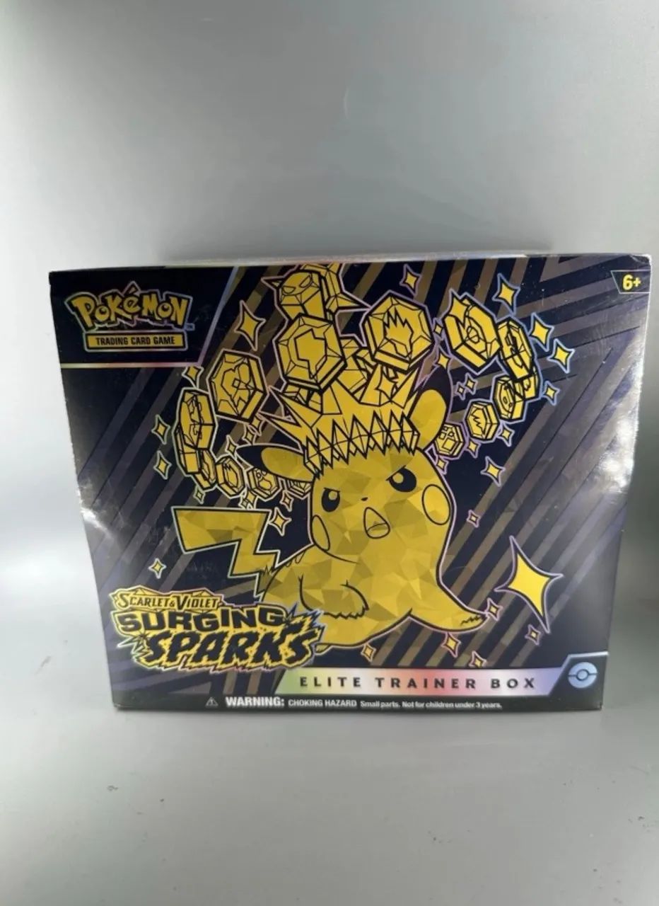 ETB- Surging Sparks Inglês Lacrada Pokémon 