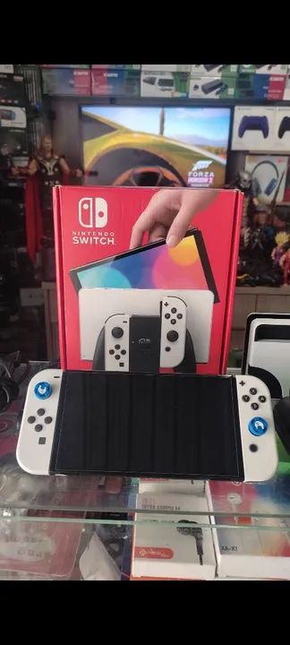 Nintendo Switch 64gb  lotado d jgs impecável semi Novo completo na cx ac trocas...