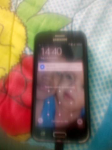 Vendo ou troco esse celular j2 funcionando tudo bom por um som ou um armário - Foto 2