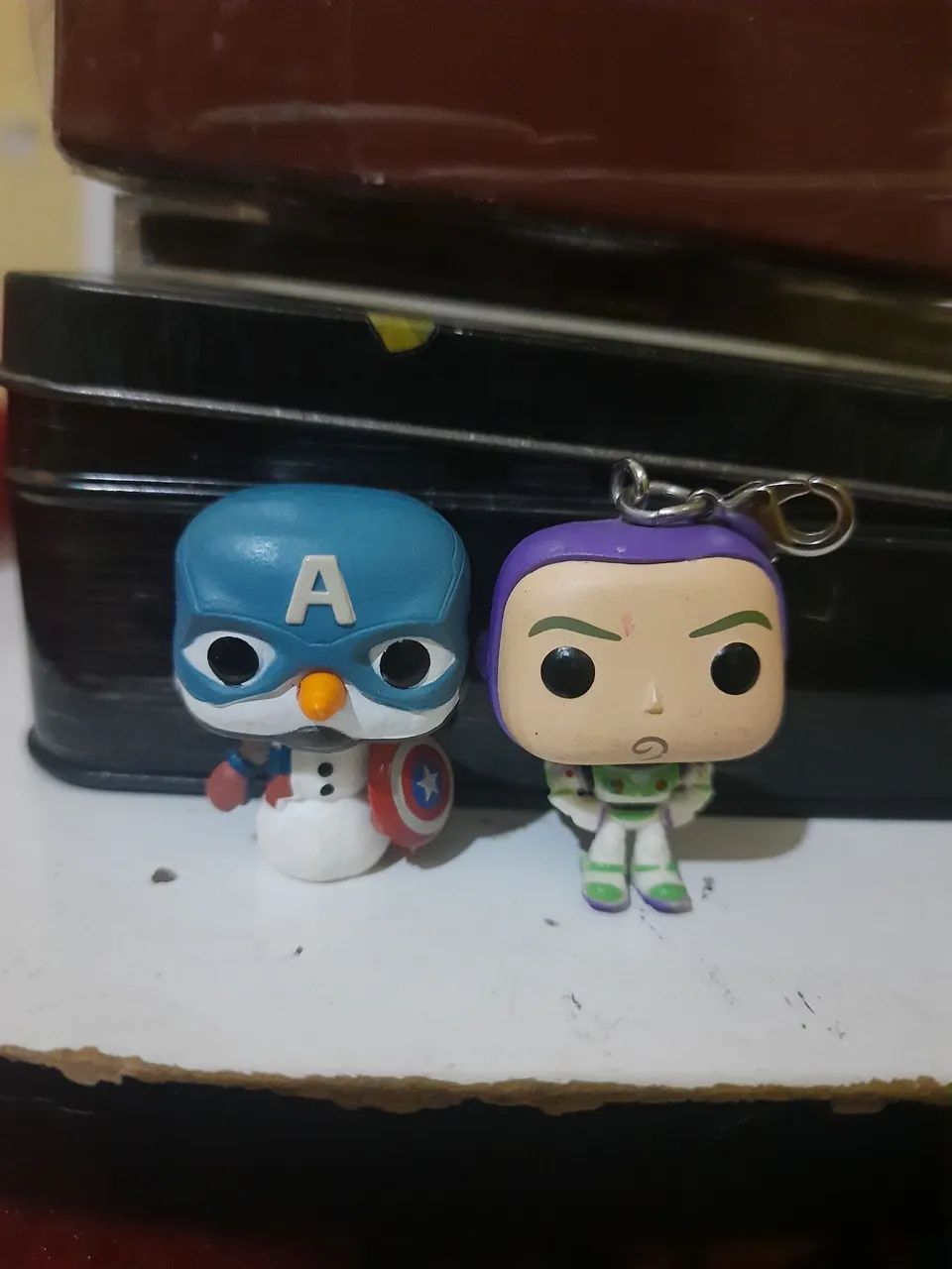 2 Funko pocket pop do Buzz lightyear e Cap Snowman 
