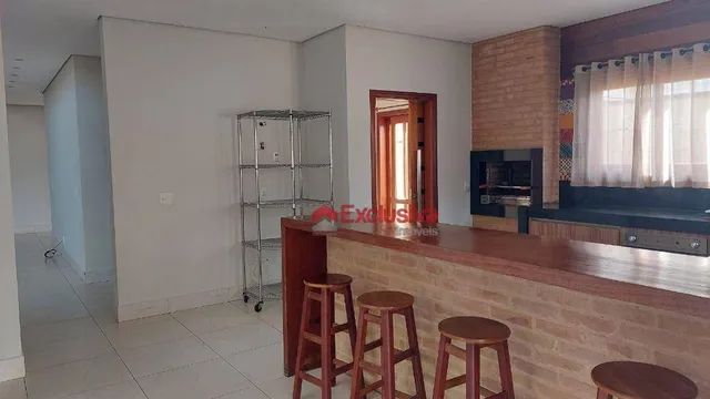 Casa com 3 dormitórios para alugar, 298 m² por R$ 6.847,08/mês - Condomínio Terras do Canc