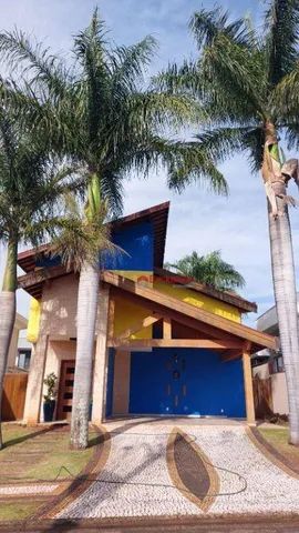 Casa com 3 dormitórios para alugar, 298 m² por R$ 6.847,08/mês - Condomínio Terras do Canc