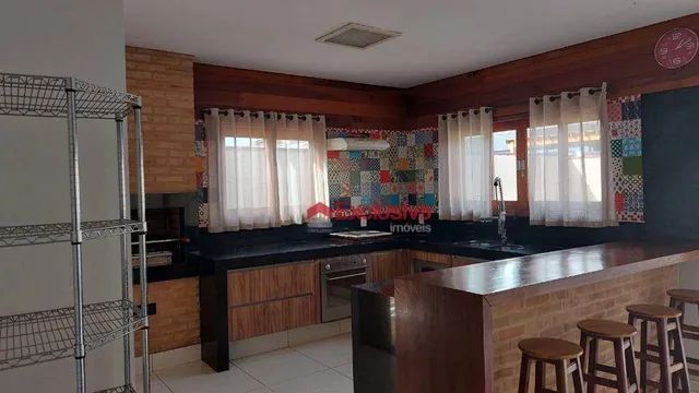 Casa com 3 dormitórios para alugar, 298 m² por R$ 6.847,08/mês - Condomínio Terras do Canc