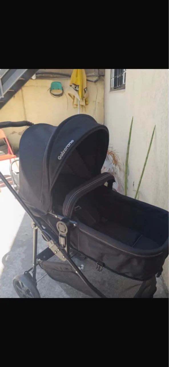 Carrinho galzerano com bebê conforto 