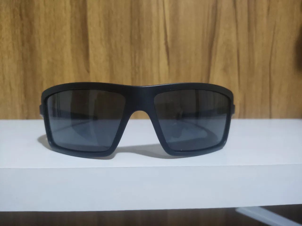 Óculos de sol preto Oakley original novo e com nota - Foto 2