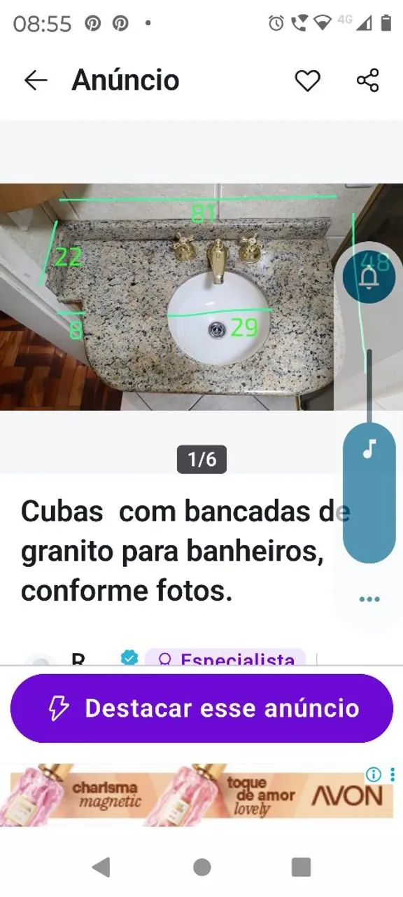 Bancada de banheiro em granito com cuba branca e metais.