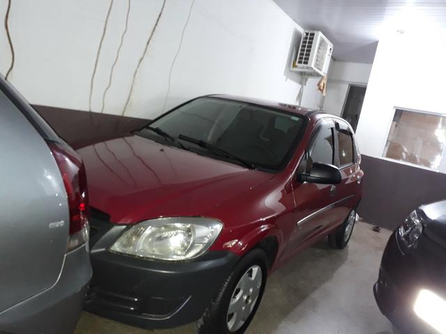 Celta 1.0 2010 com ar, trava e alarme