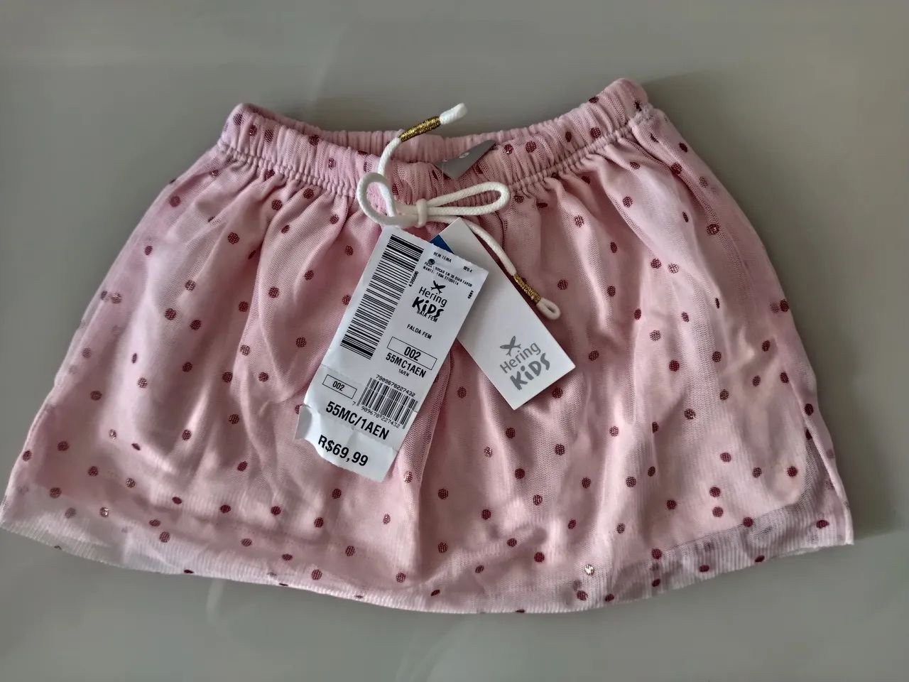 Saia de tule infantil.NOVA! Possui forro 100% algodão, elástico no cós e estampa de poás.