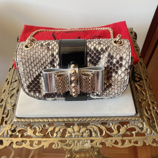 louboutin dust bolsa