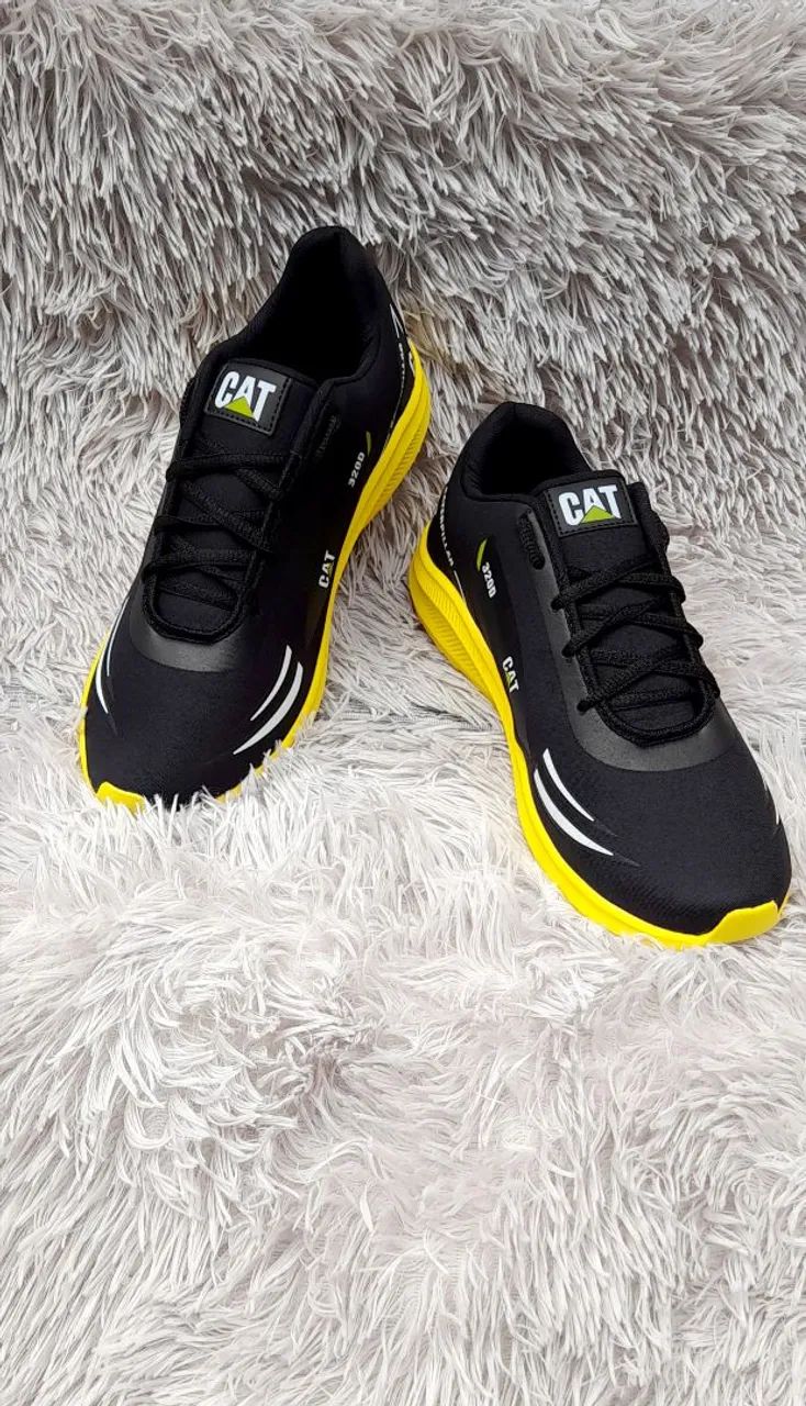 Tênis caterpillar preto C amarelo  - Foto 2