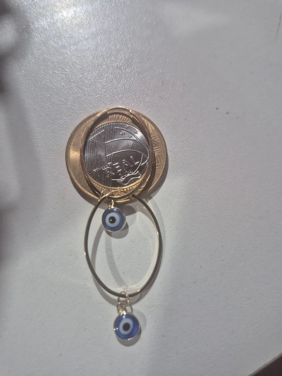 Vendo argola de ouro com pingentes de olho grego  - Foto 2