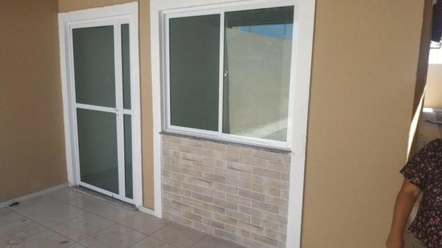 Casa com 2 quartos, 2 banheiros, varanda, sala de estar. - Foto 4