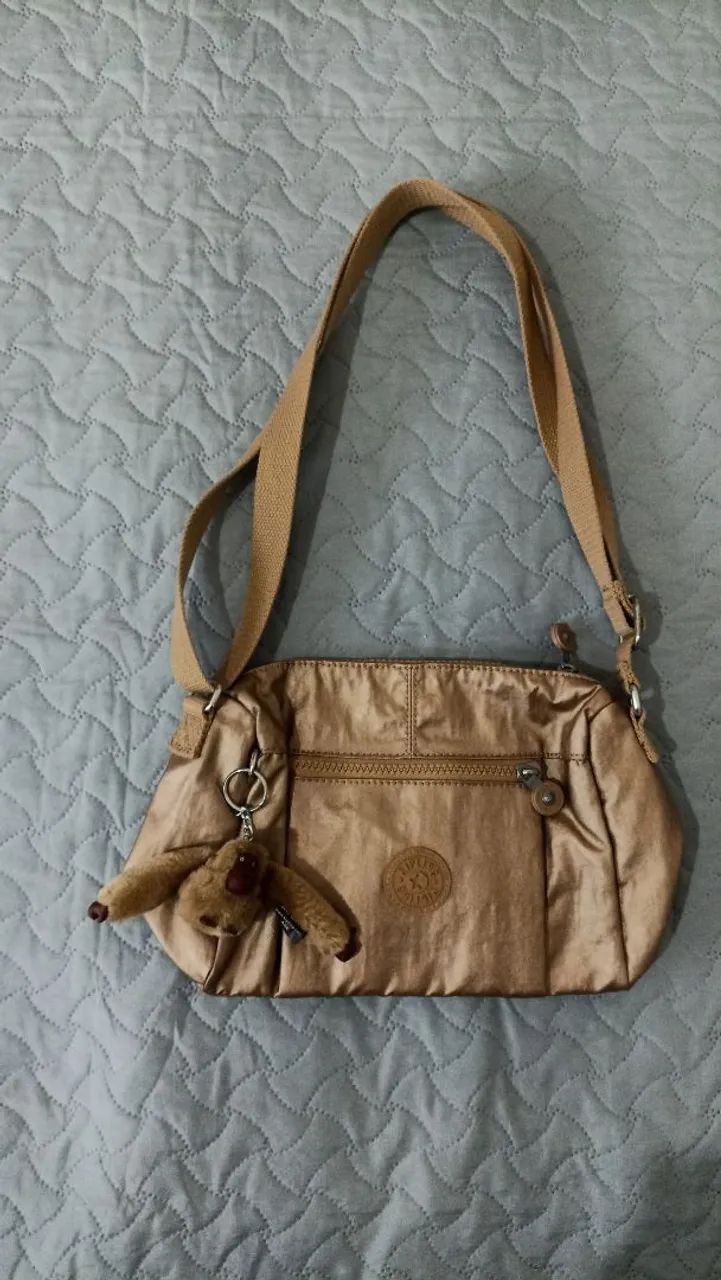 bolsa kipling pequena dourada