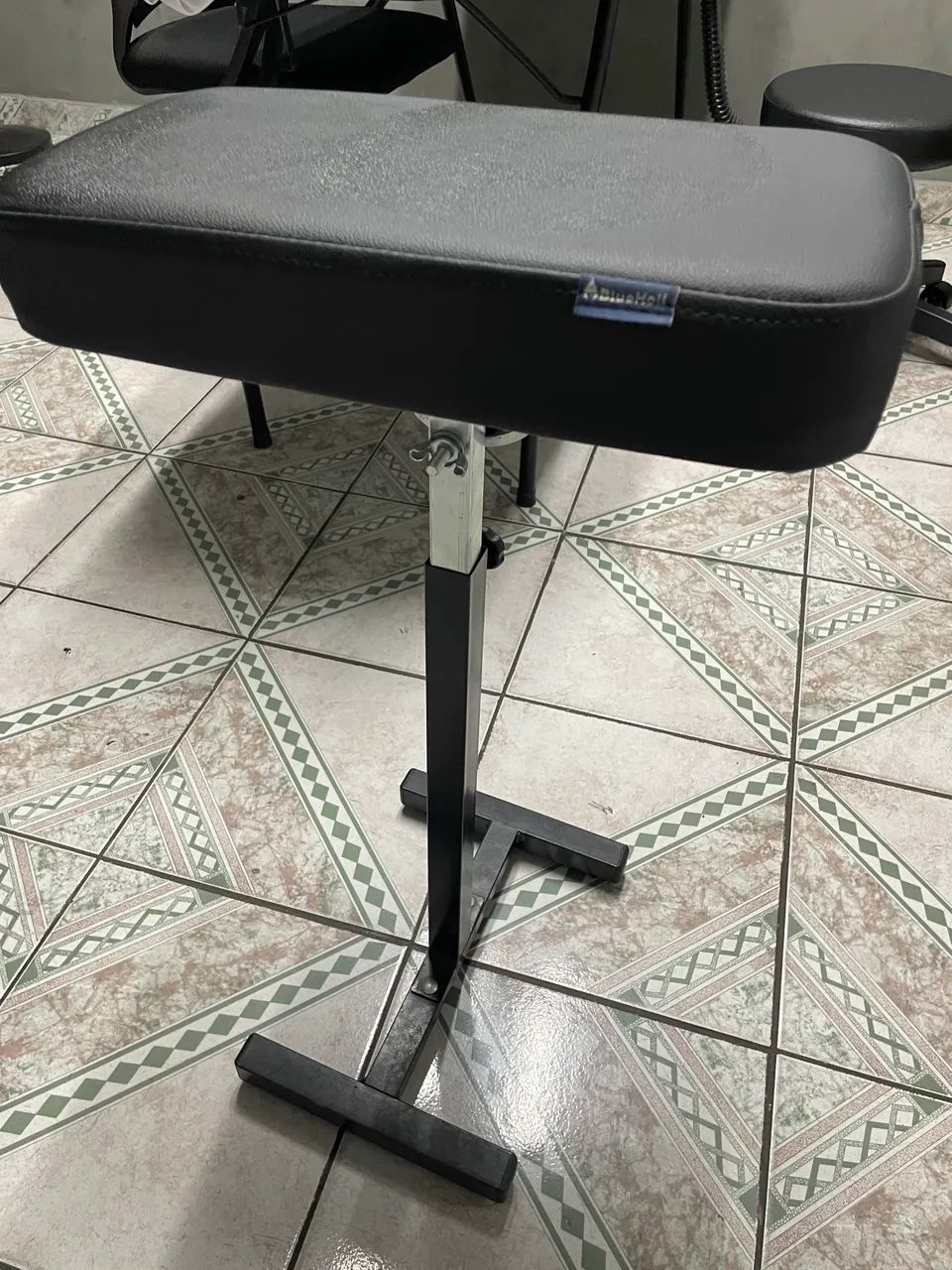 Apoio de braço para tatuagem