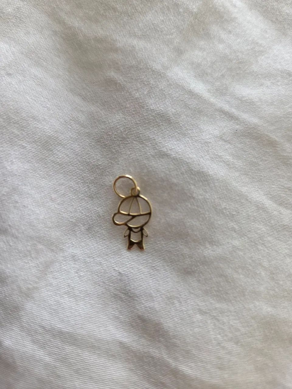 Pingente de ouro 18k 0.22  menino