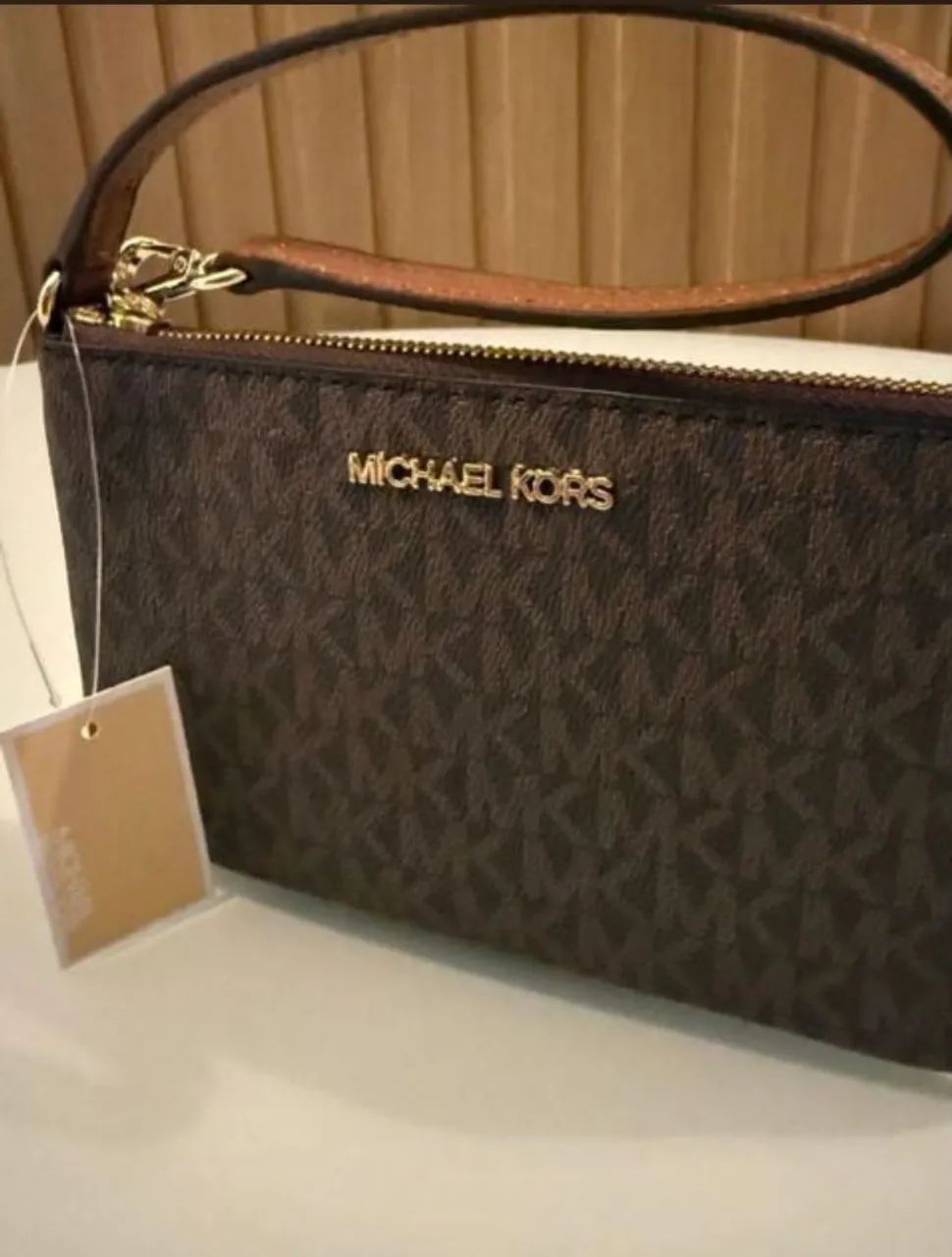 Bolsa michael kors clutch monograma 