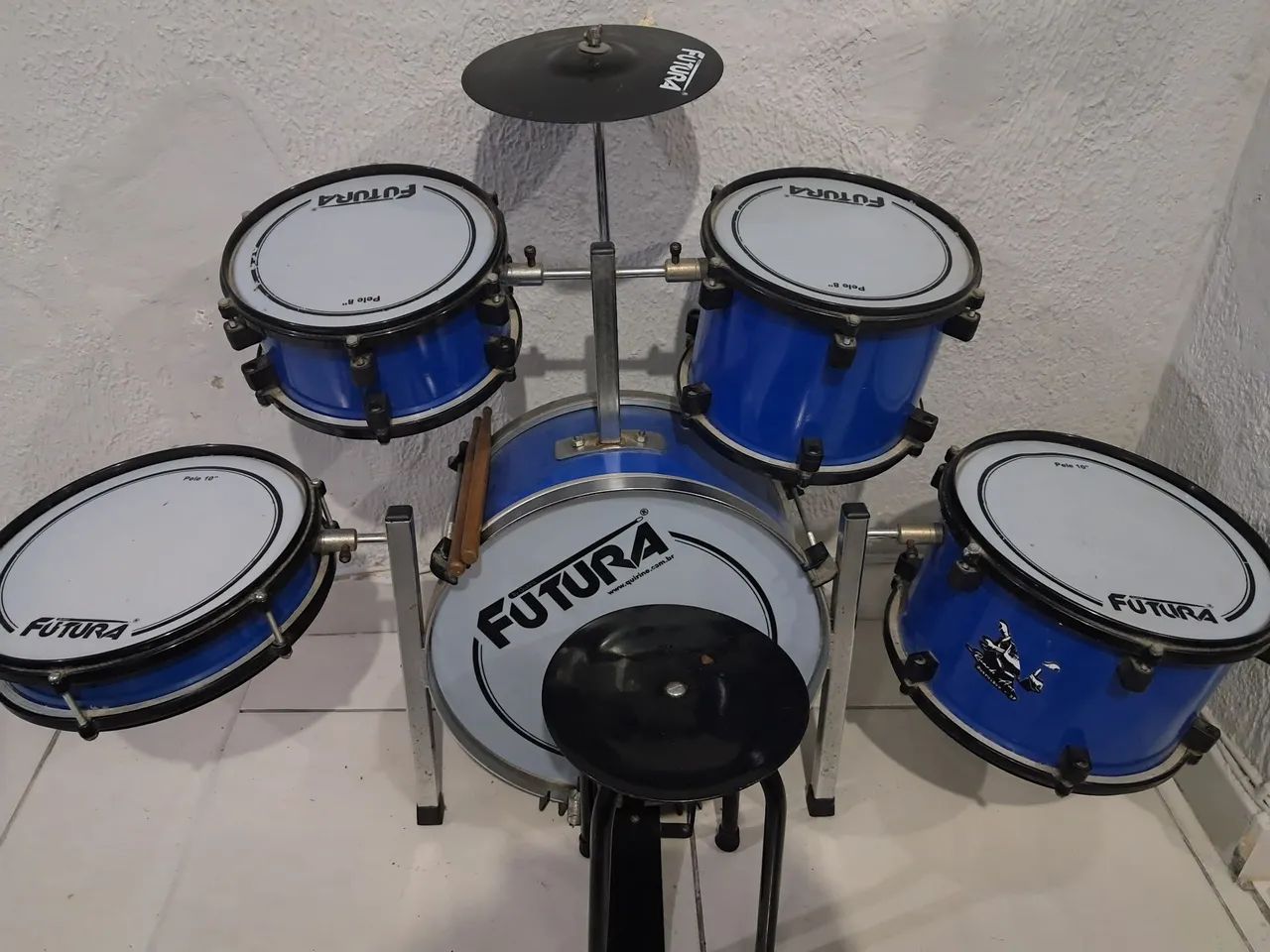 Bateria infantil usada 