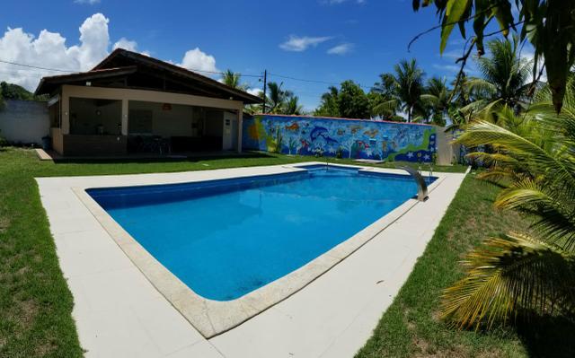 Linda casa de praia com área externa. Para final do ano