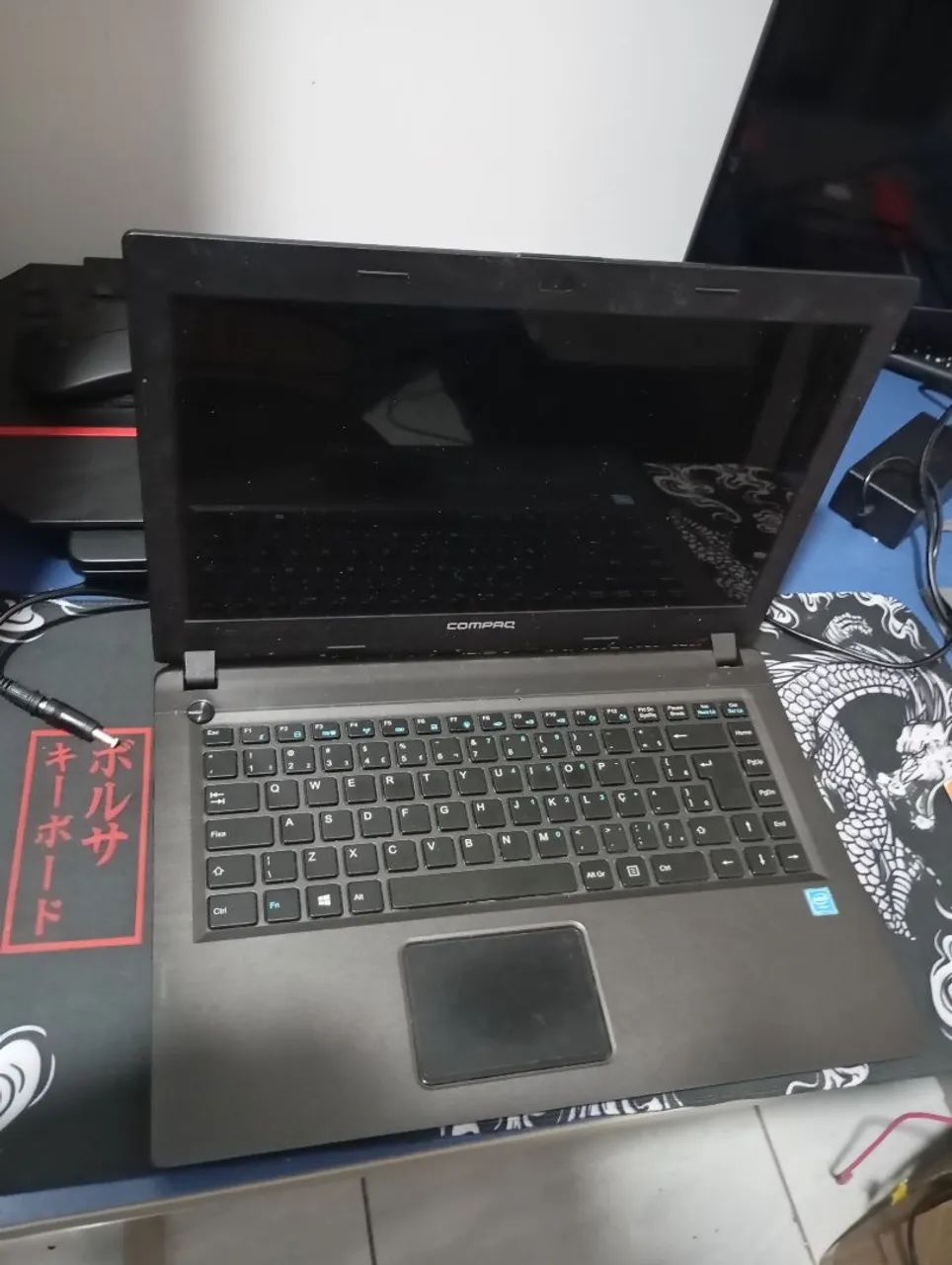 Notebook Compaq. Leia o anúncio.