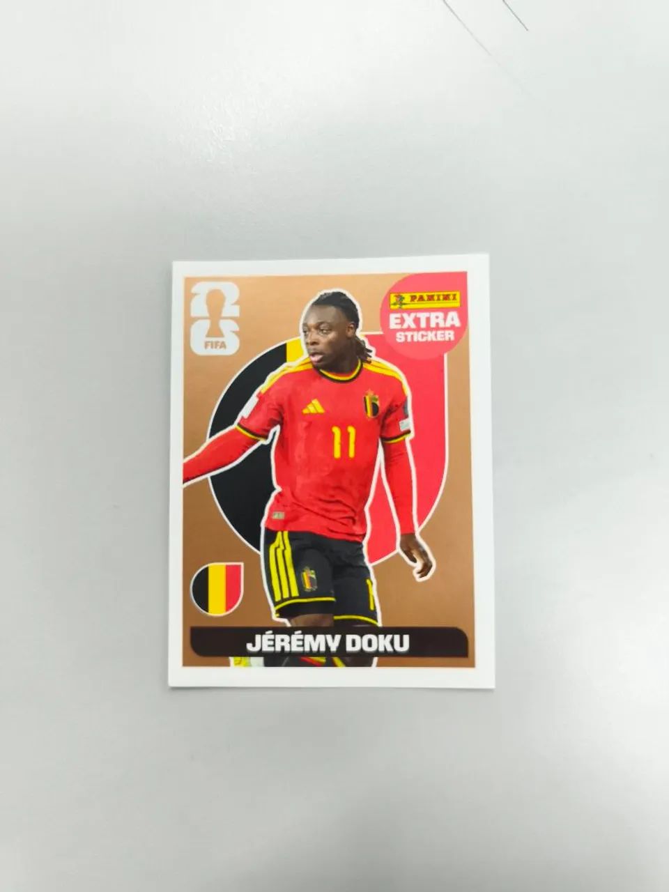 Jeremy Doku Legend Bronze ÁLBUM DA COPA 2026 - Brinquedos e Jogos