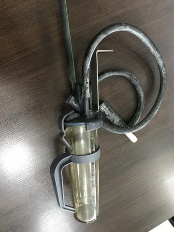 Tirador de amostra de leite