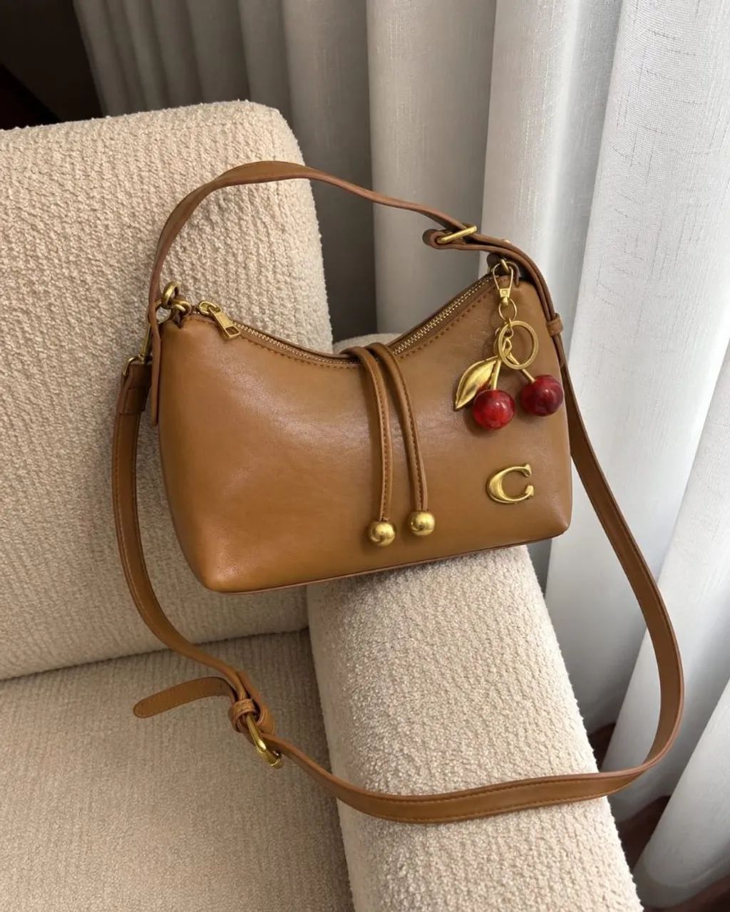 Bolsa Coach com chaveiro 
