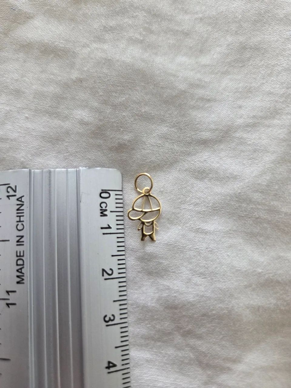 Pingente de ouro 18k 0.22  menino - Foto 2